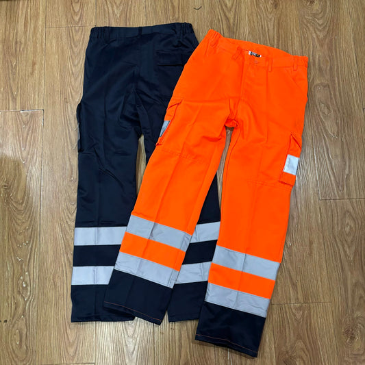 Orange and navy high visibility work pants with reflective strips for construction safety